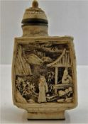 A 20thC. carved resin scent bottle