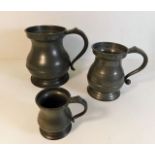 An antique pot bellied Pewter quart tankard twinne