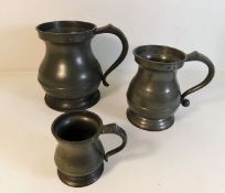 An antique pot bellied Pewter quart tankard twinne