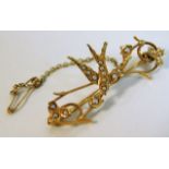 A 15ct gold swallow brooch set with seed pearls 4