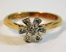 An 18ct gold ring set with small diamonds 3.4g siz