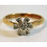 An 18ct gold ring set with small diamonds 3.4g siz