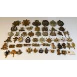 A quantity of cap badges & other military badges