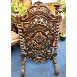 An unusual decorative 19thC. carved screen with ba