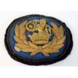 An embroidered railway cap badge