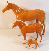 Three Beswick Palamino horses, largest 11.125in hi