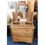 An antique oak dressing table with art nouveau cop