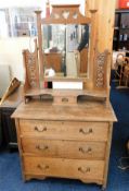 An antique oak dressing table with art nouveau cop