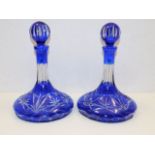 A pair of overlay cut glass Bohemian ships decante