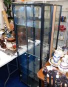 A pair of electric lit modern glass display cabine