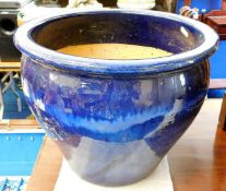 A large blue glazed planter 15in wide x 12.125in h