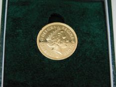 A cased 2014 full gold sovereign 7.9g