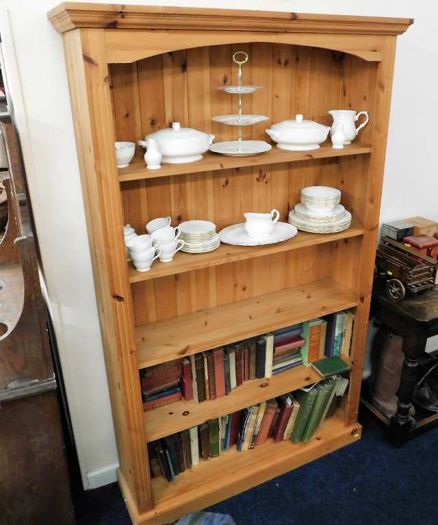 A modern solid pine bookcase 76in high x 44.25in w