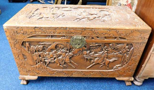 A 20thC. carved camphor wood chest with Chinoserie