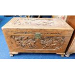 A 20thC. carved camphor wood chest with Chinoserie
