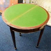 An antique mahogany card table with card holder un