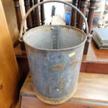 A Lister galvanised gallon bucket with measure