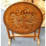 A hardwood carved table with Chinoserie decor