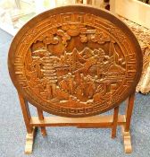 A hardwood carved table with Chinoserie decor