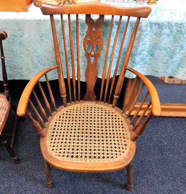 A Windsor style chair with cane seat