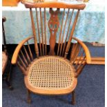 A Windsor style chair with cane seat