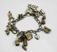 A silver charm bracelet 51.4g