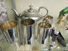 A silver plated tea pot twinned with four silver p