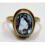 A 9ct gold ring set with blue paste stone size T 4