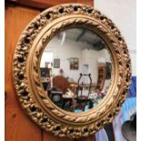 A gilt framed convex mirror 17in diameter