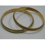 A pair of two colour 18ct gold bangles 72g