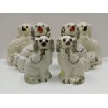 Three pairs of Staffordshire pottery dogs, tallest