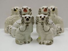 Three pairs of Staffordshire pottery dogs, tallest