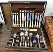 An oak cased plated cutlery set twinned with a woo