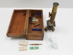 An antique brass field telescope with box