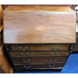 A mahogany bureau with inlaid decor