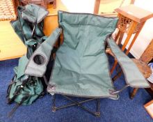 Two folding canvas style chairs twinned with a sma