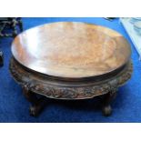 An early 20thC. finely carved low level Oriental opium table, with burr wood top 30.5in wide x 14in