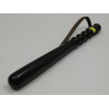 A wooden police truncheon