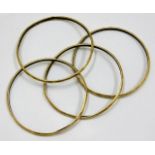 A set of four yellow metal bangles a/f test as 18c