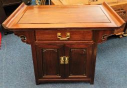 A Chinese hardwood altar cabinet with quality bras