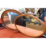 Two early 20thC. oval framed mirrors