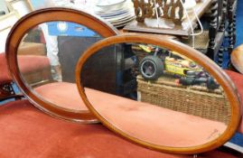 Two early 20thC. oval framed mirrors