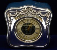 A decorative silver fronted mantle clock 4.75in hi