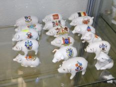 A quantity of crested ware pigs