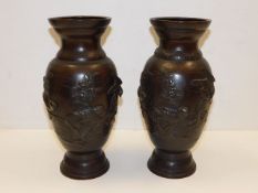 A pair of decorative Meiji period Japanese bronze