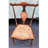 A small antique childs chair