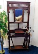 An Edwardian mahogany hall stand with mirror, coat