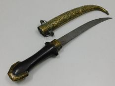 A Persian style dagger with decorative brass sheaf