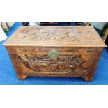 A 20thC. carved camphor wood chest with Chinoserie