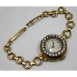 An antique 18ct gold cased 15 jewelled wrist watch